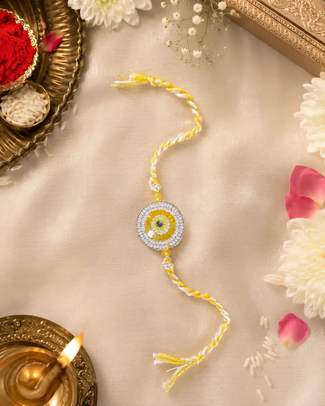 Yellow circular stone rakhi